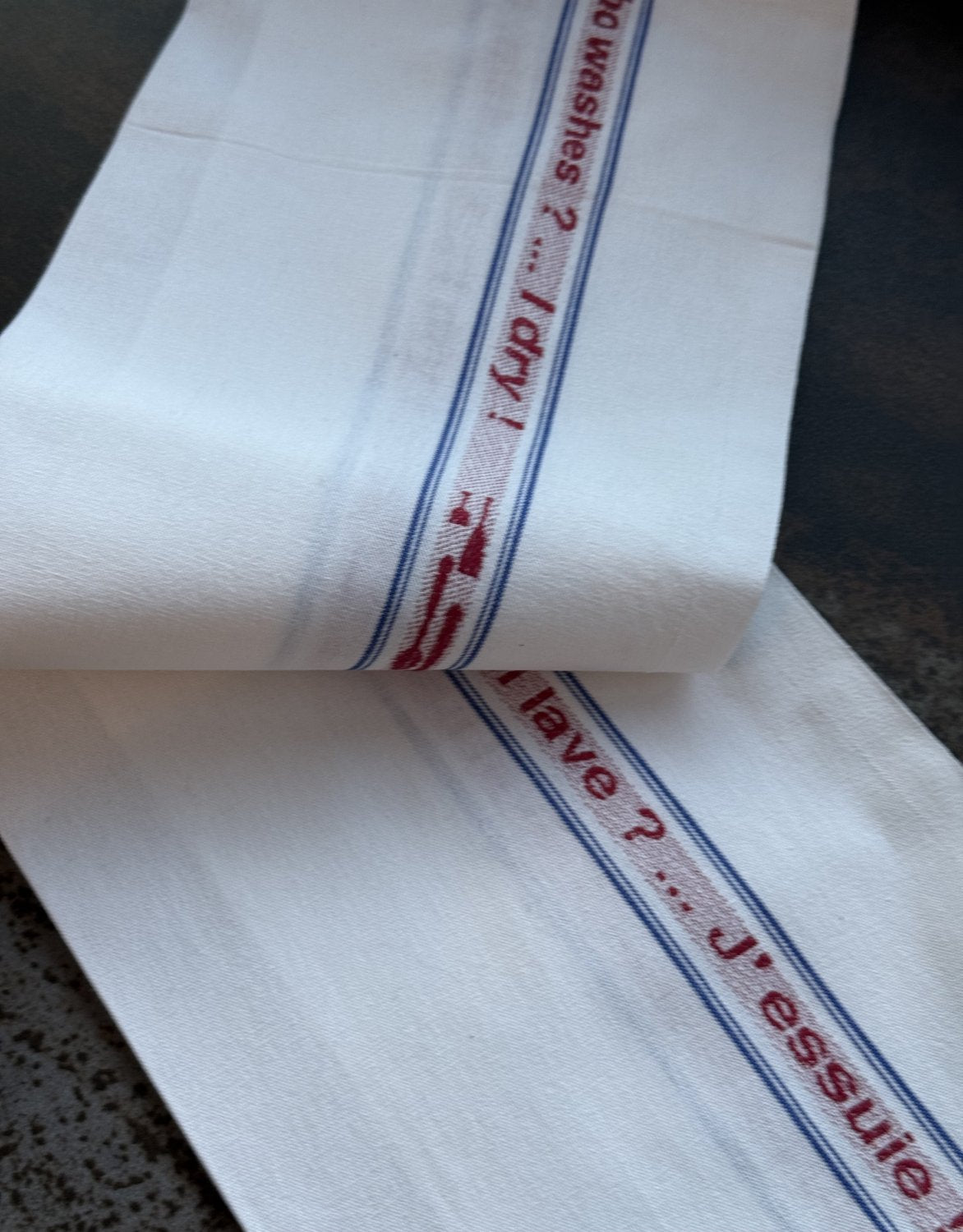 Charvet Editions "Qui Lave? J’Essuie!", white woven cotton tea towel. Made in France. - Home Landing