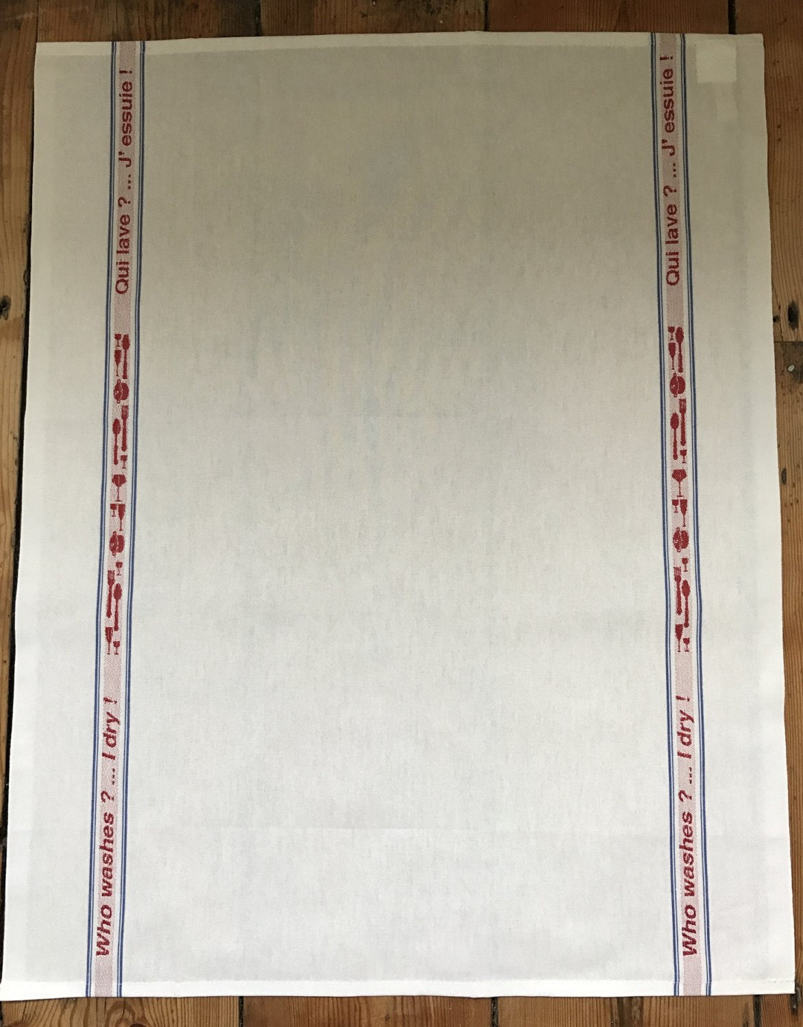 Charvet Editions "Qui Lave? J’Essuie!", white woven cotton tea towel. Made in France.