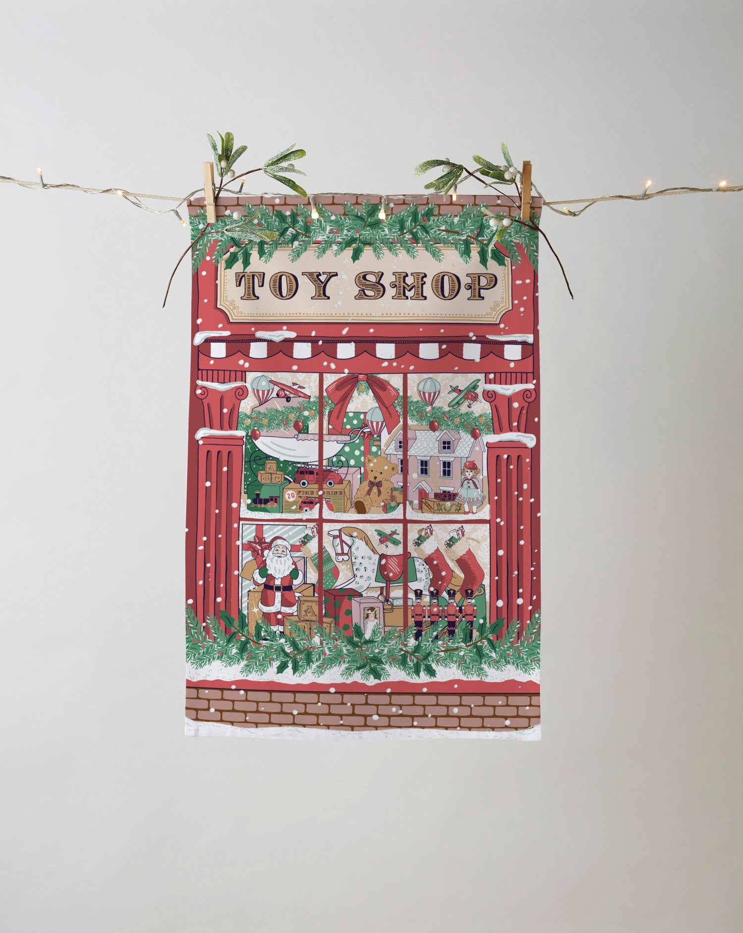 Ulster Weavers, "Christmas Toy Shop", Sustainable printed tea towel.