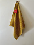 Coucke "Safran Eyelet", Cotton terry hand towel. Designed in France.