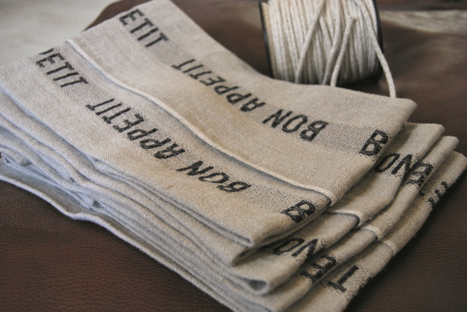 Charvet Éditions "Bon Appetit" (Black), Natural woven linen tea towel. Made in France. - Home Landing